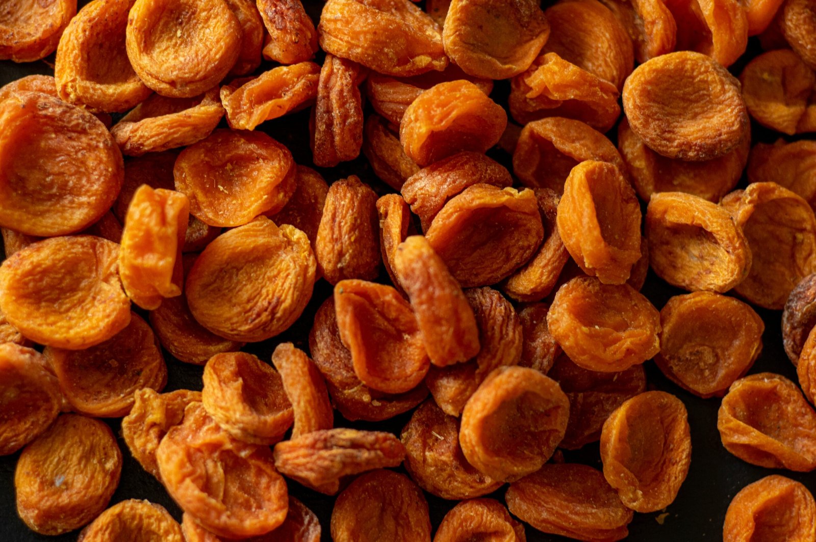 brown almond nuts on brown wooden surface
